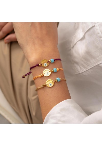 Χειροποίητο βραχιόλι της Excite Fashion Jewellery, μακραμέ, καφέ κορδόνι, επίχρυσο μοτίφ με ματάκι και τιρκουάζ χάντρα. B-1771-05