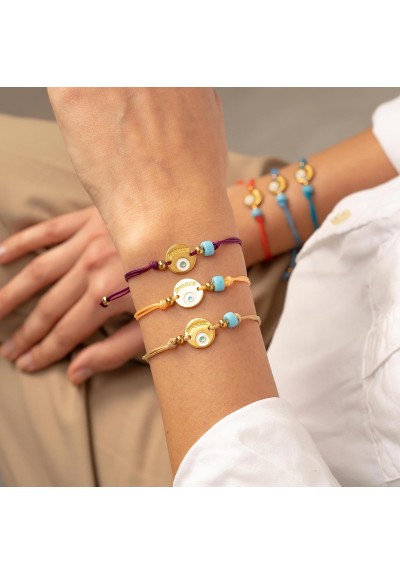 Χειροποίητο βραχιόλι της Excite Fashion Jewellery, μακραμέ, πορφυρό βυσσινί κορδόνι, επίχρυσο μοτίφ με ματάκι και τιρκουάζ χάντρα. B-1771-24