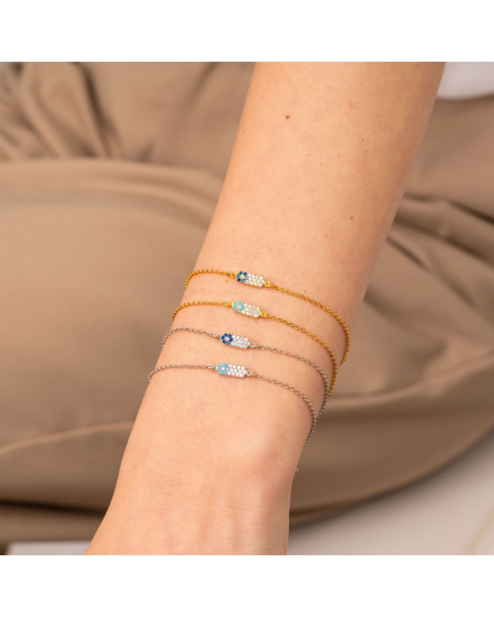 Βραχιόλι της Excite Fashion Jewellery με μοτίφ μπάρα στολισμένη με λευκά και τυρκουάζ  ζιργκόν  σε σχέδιο ματάκι  από επιπλατινωμένο ασήμι 925. B-55-TYRK-S-6 Κοσμήματα